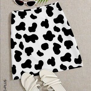 Cute cow print skirt with matching headband. Skirt is in a 3X. Price for both.